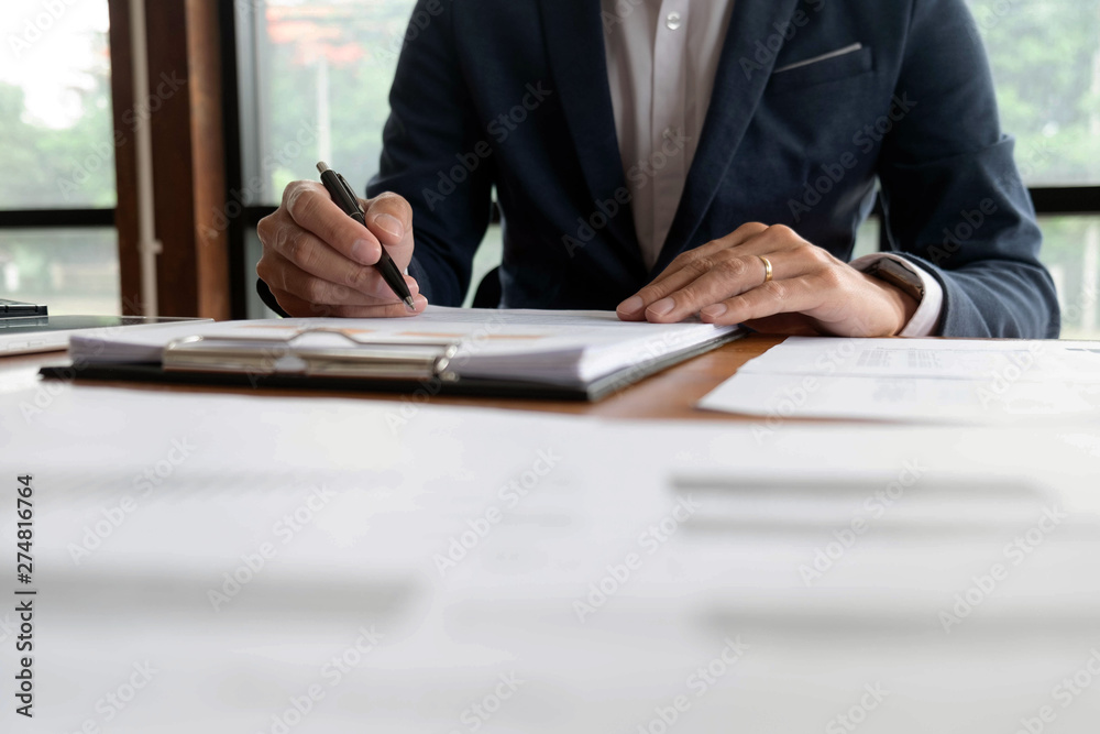 Businessmen, finance, accounting work, checking accounts, using calculators and finding information Businessmen, finance, accounting work, checking accounts, using calculators and finding information