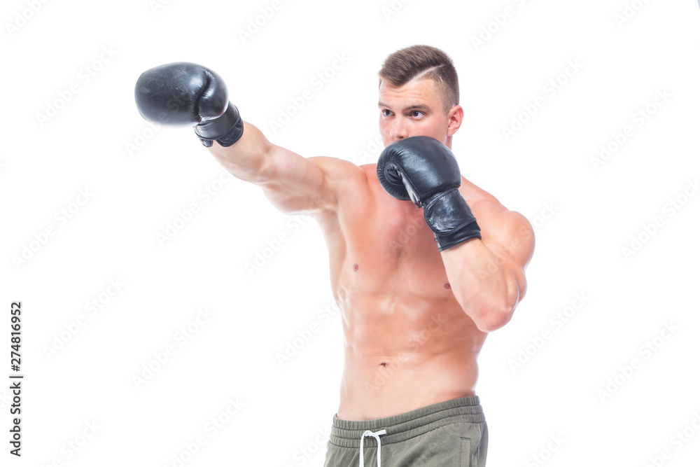 Muscular young man in black boxing gloves and shorts shows the different movements and strikes in the studio on a white background. Strong Athletic Man - Fitness Model showing his perfect body. Copy Muscular young man in black boxing gloves and shorts shows the different movements and strikes in the studio on a white background. Strong Athletic Man - Fitness Model showing his perfect body. Copy