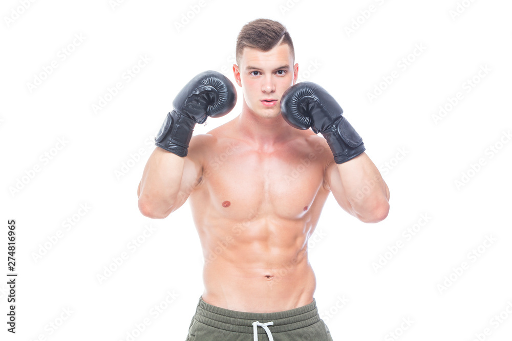 Muscular young man in black boxing gloves and shorts shows the different movements and strikes in the studio on a white background. Strong Athletic Man - Fitness Model showing his perfect body. Copy Muscular young man in black boxing gloves and shorts shows the different movements and strikes in the studio on a white background. Strong Athletic Man - Fitness Model showing his perfect body. Copy