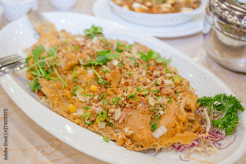 Chinese cooking, deep fried flat fish © GEOLEE