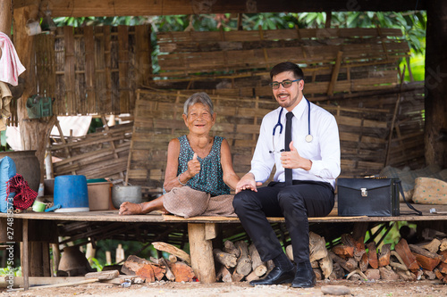 The doctor checks the health of the elderly in the rural of asian.