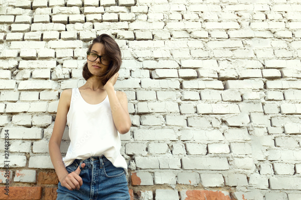 Portrait of a young student with glasses.