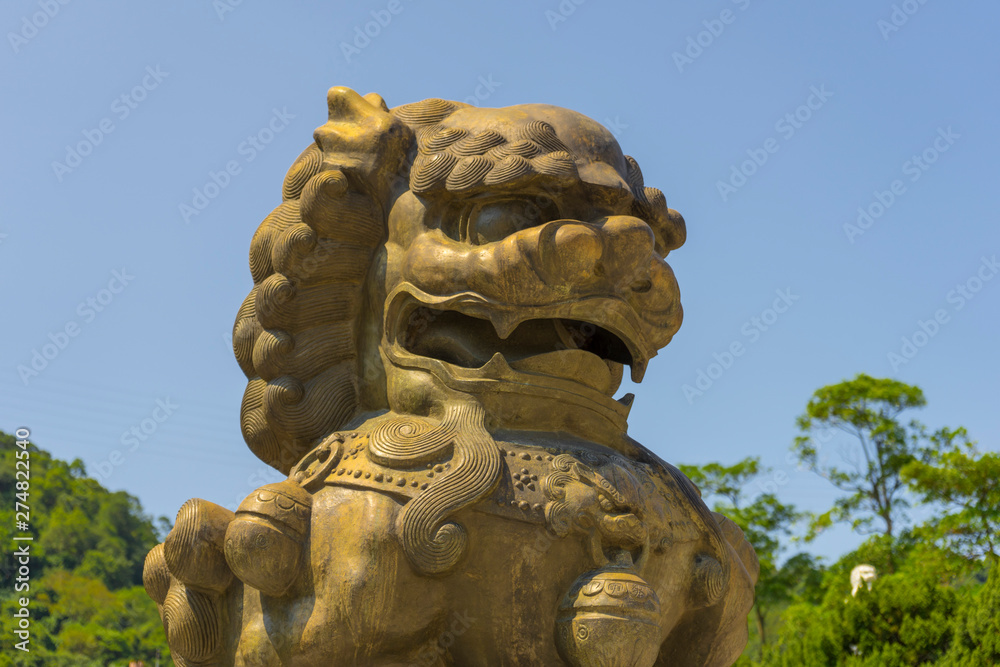 Golden guardian lion in front of Gu Gong National Palace Museum in Taipei,Taiwan.