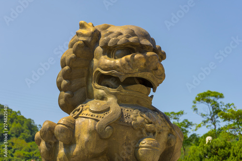 Golden guardian lion in front of Gu Gong National Palace Museum in Taipei,Taiwan.