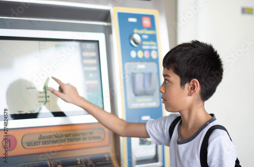 BANGKOK, THAILAND - JUNE 22, 2019: Student Passenger by BTS automatice machine ticket to entrance in subway station.