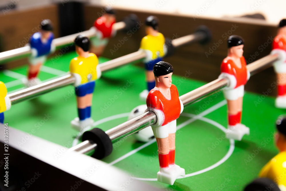 A close up side view of a foosball table A close up side view of a foosball table