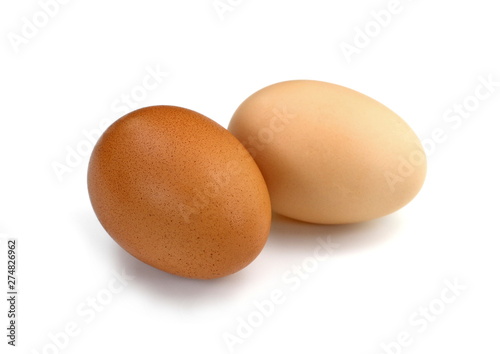 Raw Eggs on White Background. Brown and white eggs.
