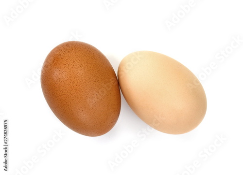 Raw Eggs on White Background. Brown and white eggs.