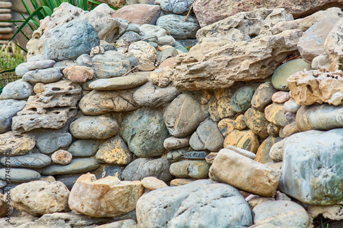 Lined wall of round stones.