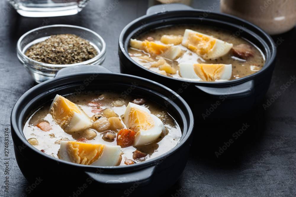 The sour soup made of rye flour with eggs The sour soup made of rye flour with eggs