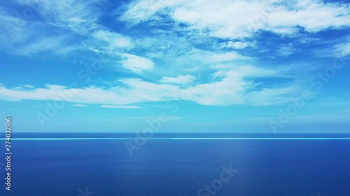 Wallpaper Mural A blue summer sky with clouds above the deep blue Philippine Sea. Pan left, wide angle. One third of water. Torontodigital.ca