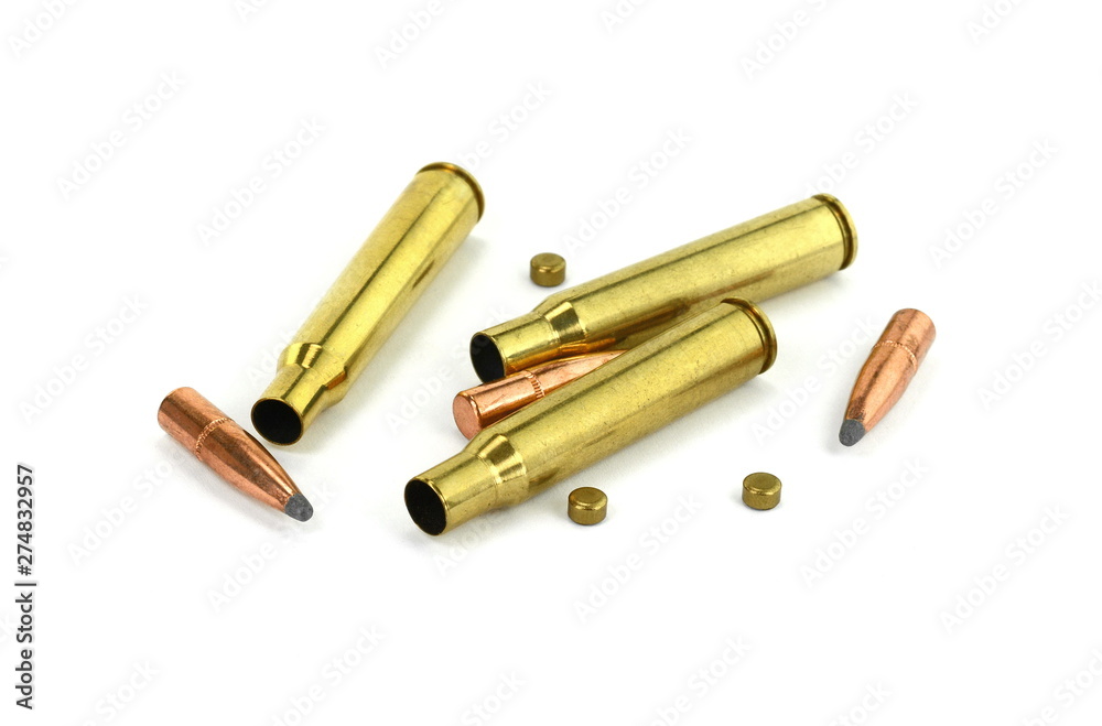 A rifle bullet, empty shell, gunpowder on white background. Hunting ammunition isolated on white. A rifle bullet, empty shell, gunpowder on white background. Hunting ammunition isolated on white.
