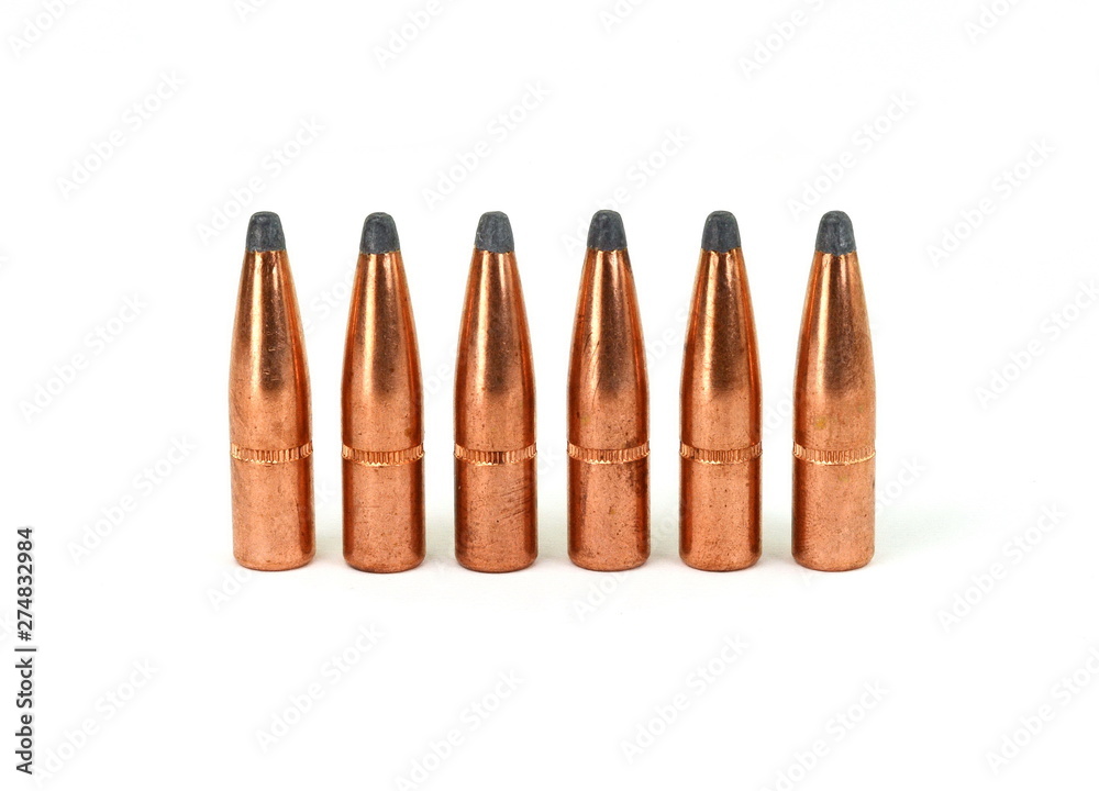 A rifle bullet. Hunting ammunition isolated on white. A rifle bullet. Hunting ammunition isolated on white.