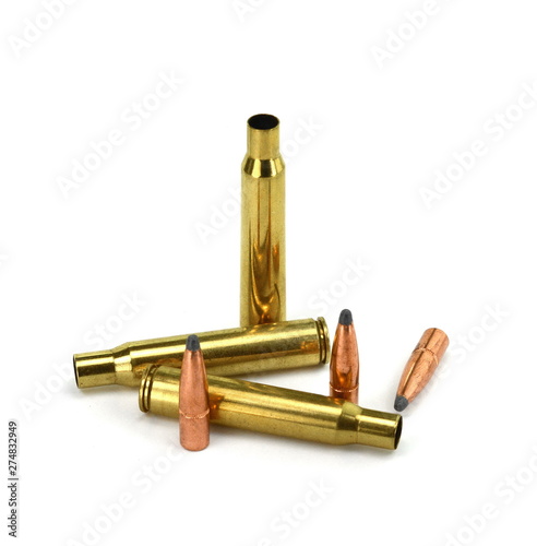 A rifle bullet  empty shell  gunpowder on white background. Hunting ammunition isolated on white.