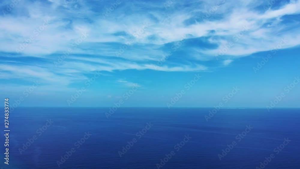 A Cirrostratus clouds above the blue Philippine Sea in a blue Sky Static. A Cirrostratus clouds above the blue Philippine Sea in a blue Sky Static.