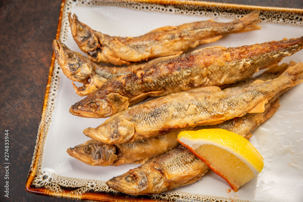 Crispy deep-fried small fish with lemon Crispy deep-fried small fish with lemon