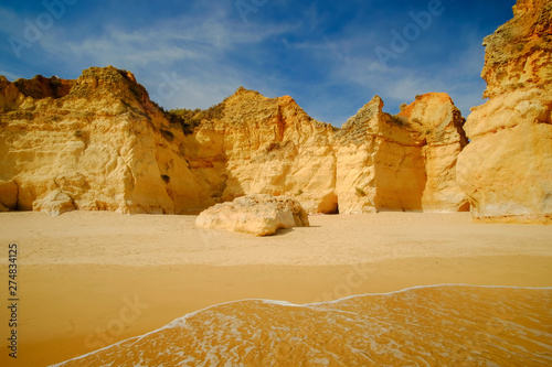 View on beautiful cliffs in Algarve. Beach Careanosy in Portimao. Vacation in Portugal. photo