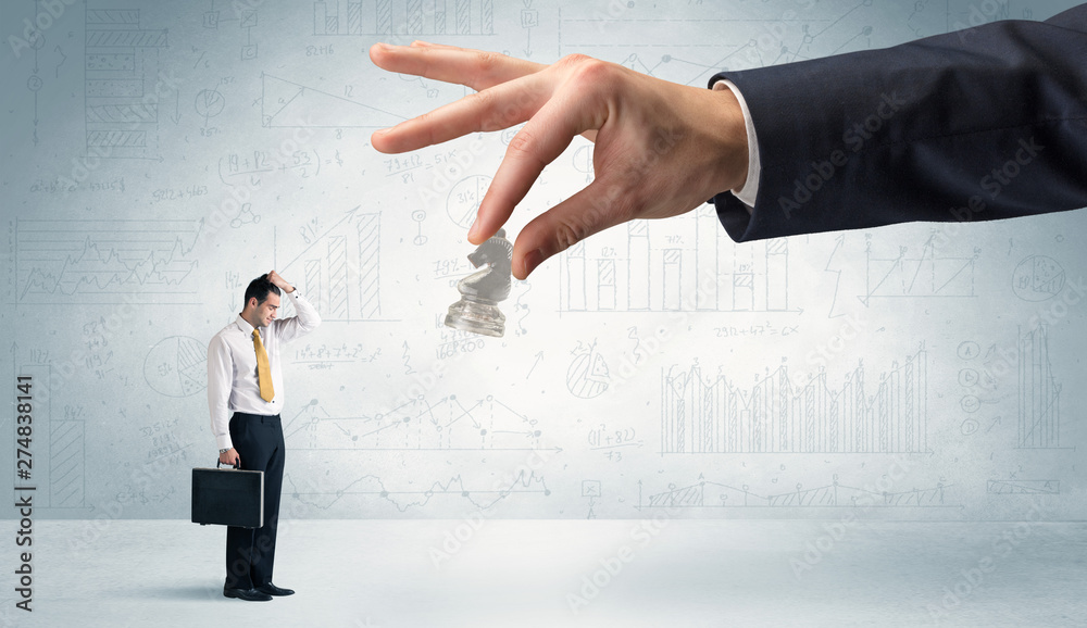 Little businessman is afraid to make the next step in his chess game with graphs, charts and reports background
Little businessman is afraid to make the next step in his chess game with graphs, charts and reports background