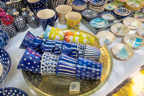 Beautiful traditional colored pottery sold at handicraft market. Tel-Aviv. Israel photo