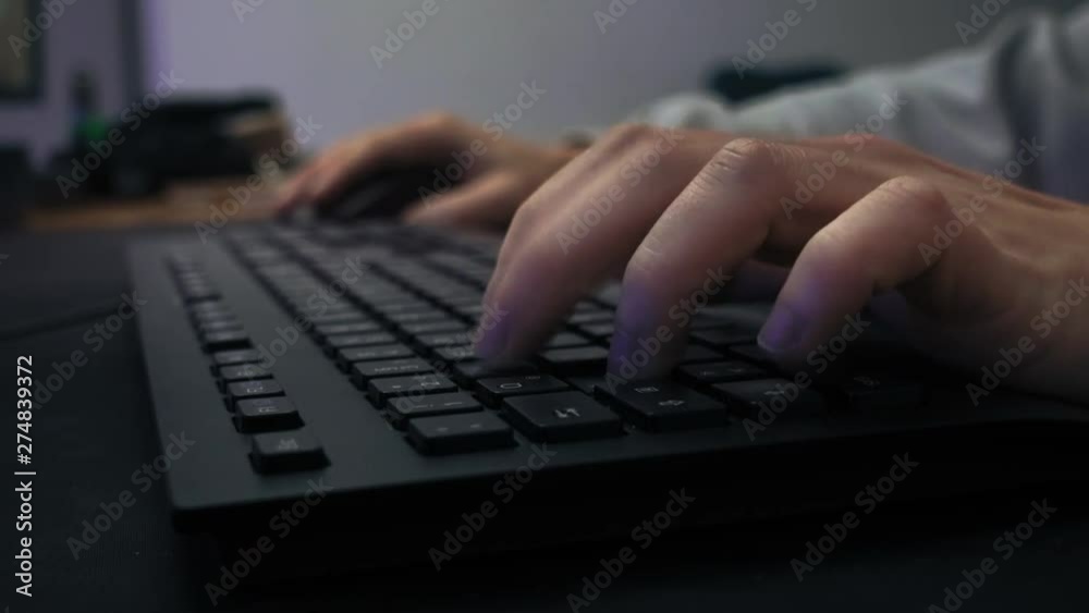 Closeup of the keyboard and a mouse used by a male gamer Closeup of the keyboard and a mouse used by a male gamer