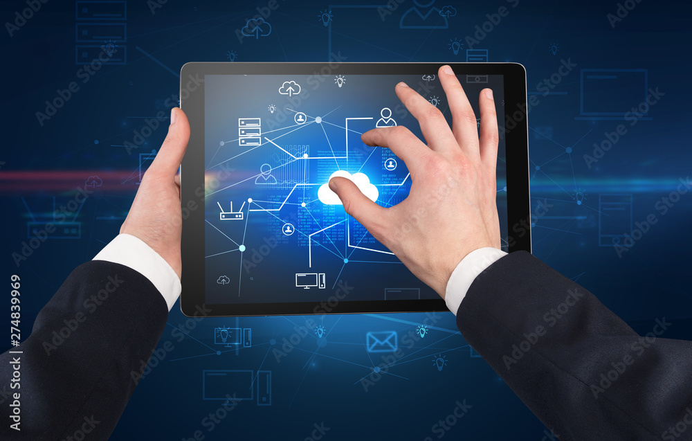 First person view of a hand using tablet with cloud office concept
