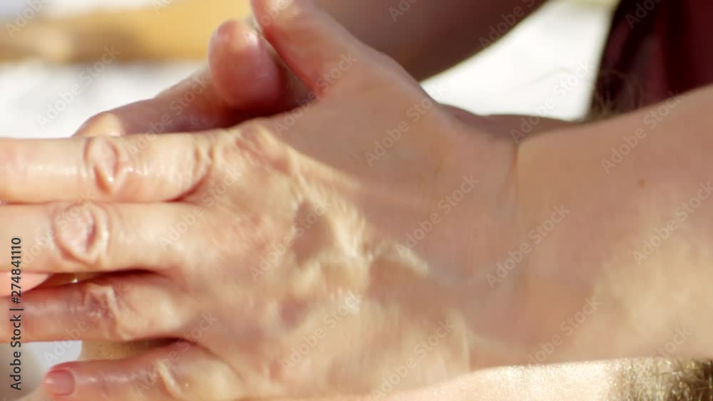 Close up of young Caucasian man getting facial massage in spa center Close up of young Caucasian man getting facial massage in spa center