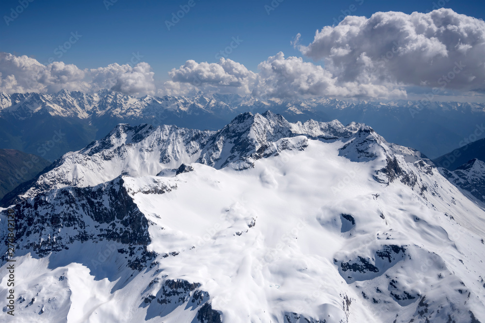 Obraz premium spring snow on Scalino peak range north side, Sondrio, Italy