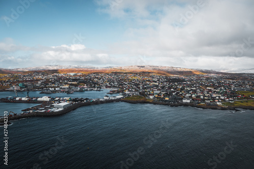 Aerial shot of the town Torshavn and its harbour as taken during a helicopter flight on an early spring morning (Faroe Islands, Denmark, Europe)