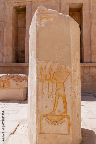 Mortuary temple of Hatshepsut in Deir el-Bahari. Ancient wall with the engraved Egyptian hieroglyphs. Deir el-Bahari, Egypt. photo