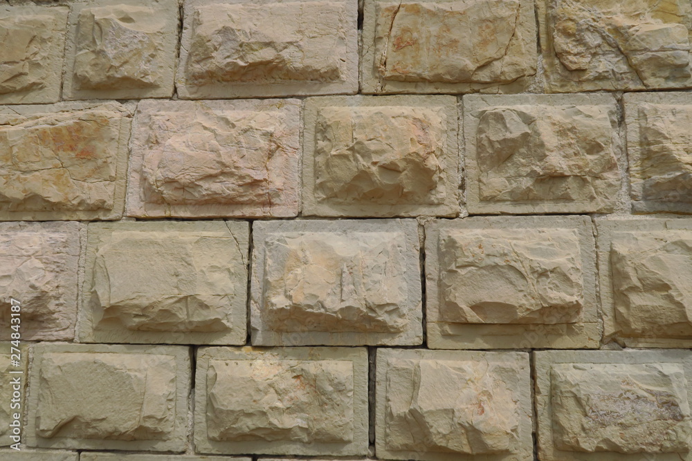 Fototapeta premium Mur de pierres avec bordures polies.