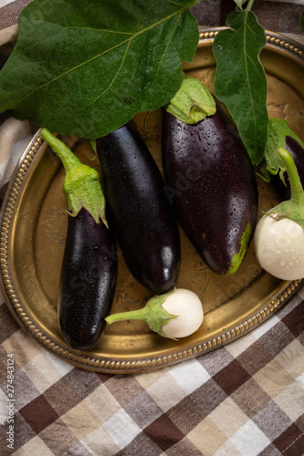 Fresh local eggplants on platter