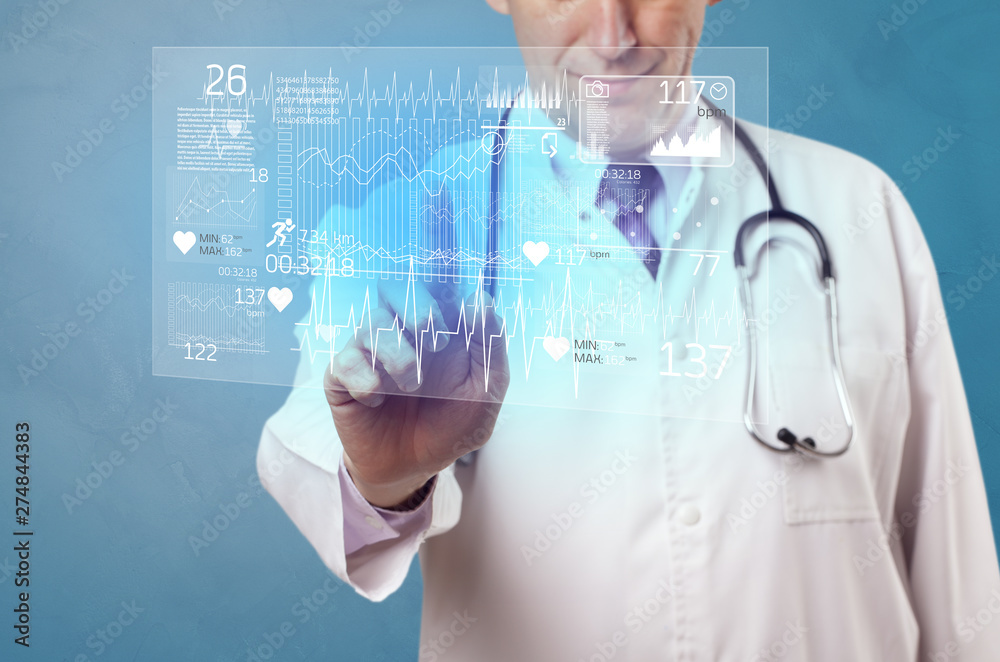 Doctor touching hologram screen displaying healthcare running symbols
Doctor touching hologram screen displaying healthcare running symbols