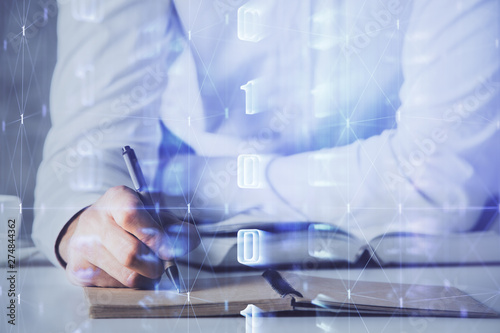 Man in white shirt with technology icons.