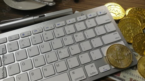 The Bitcoin coin on silver keyboard for  cryptocurrency content.