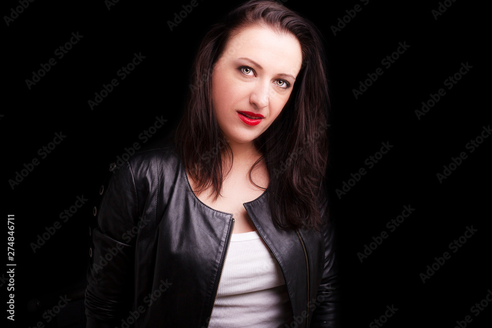 Beautiful dark girl  in rock style on a black background.
