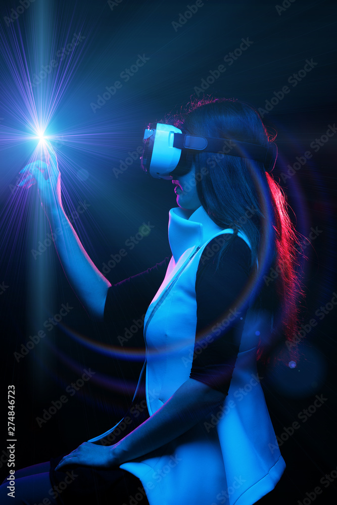 Woman is using virtual reality headset. Woman is using virtual reality headset.