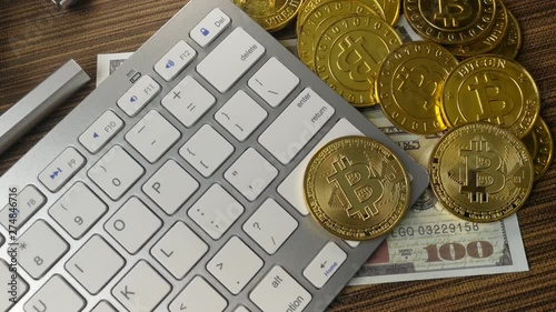The Bitcoin coin on silver keyboard for  cryptocurrency content.