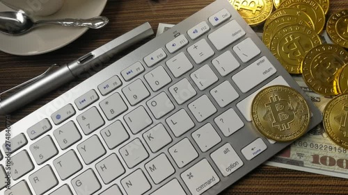 The Bitcoin coin on silver keyboard for  cryptocurrency content.