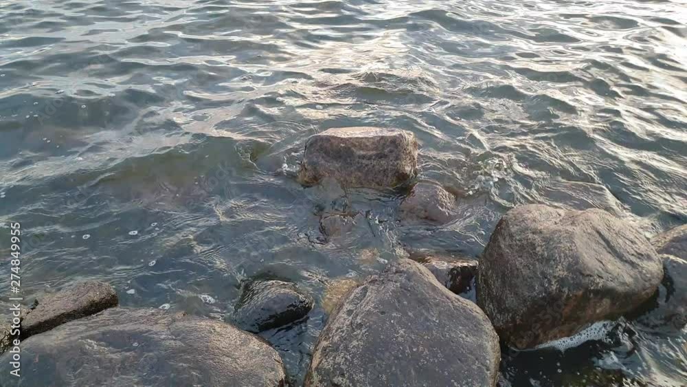 Stone shore on the river. Stones on the river. Stone shore on the river. Stones on the river.