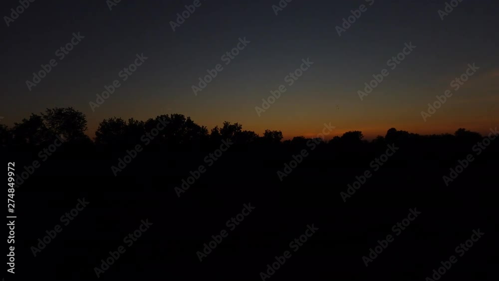Sunset time lapse with sun and orange, blue sky Sunset time lapse with sun and orange, blue sky