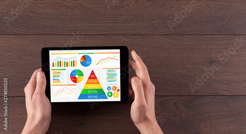 Tableau sur toile Business hand with tablet making analyses and checking the daily calories