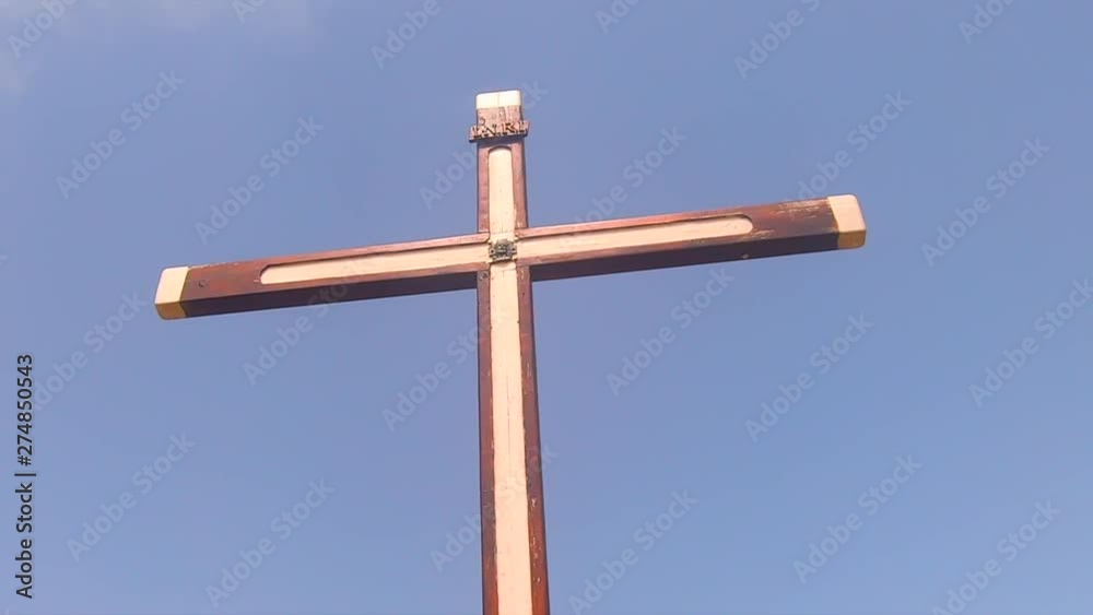 Christian cross on a bright day with the blue sky in the backround. Christian cross on a bright day with the blue sky in the backround.