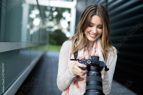 Woman is a professional photographer with dslr camera