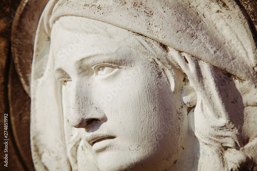  Fragment of ancient statue of Virgin Mary in profile. Religion, faith, Christianity concept.