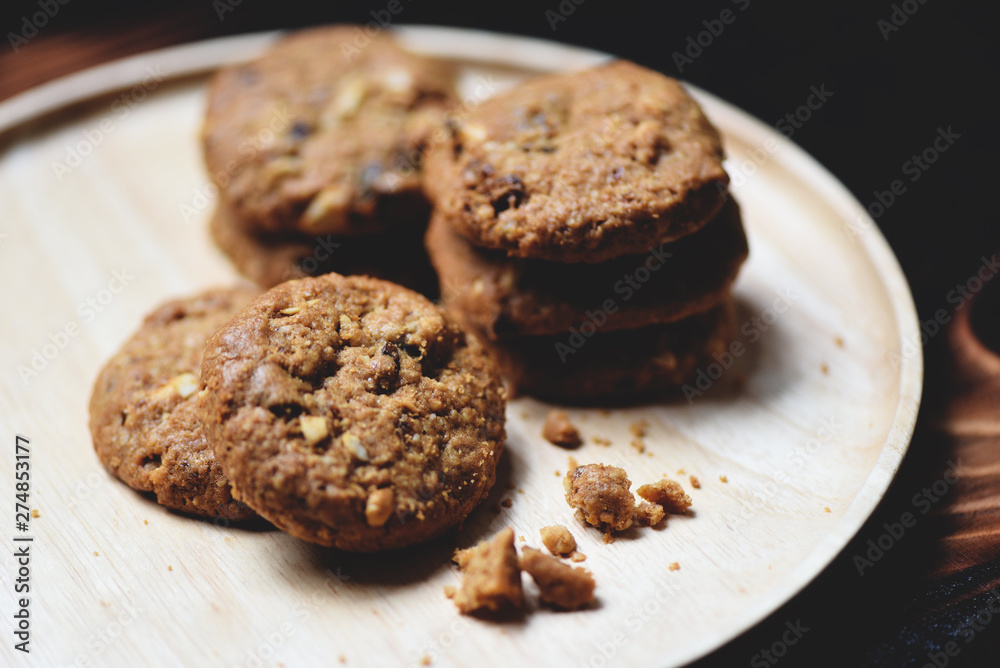 cookies with nut on wooden table dark background