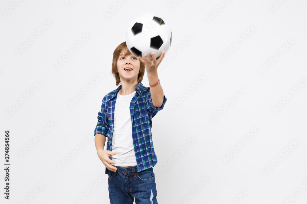 Football fan kid boy blue t-shirt cheer up support favorite team with soccer ball isolated on white wall background children studio portrait. People childhood sport family leisure lifestyle concept