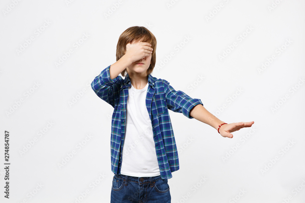 Fun shocked surprised little kid boy in blue t-shirt put hands on face, hiding cover isolated on white wall background children studio portrait. People childhood lifestyle concept. Mock up copy space. Fun shocked surprised little kid boy in blue t-shirt put hands on face, hiding cover isolated on white wall background children studio portrait. People childhood lifestyle concept. Mock up copy space.
