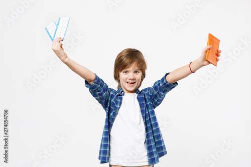 Traveler tourist kid boy in blue t-shirt hold tickets isolated on white wall background studio portrait. People childhood lifestyle. Passenger traveling abroad on weekends. Air flight journey concept.