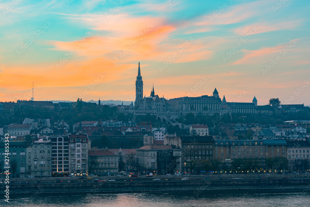 Sunset view of the Matthias Church and River Danube bank