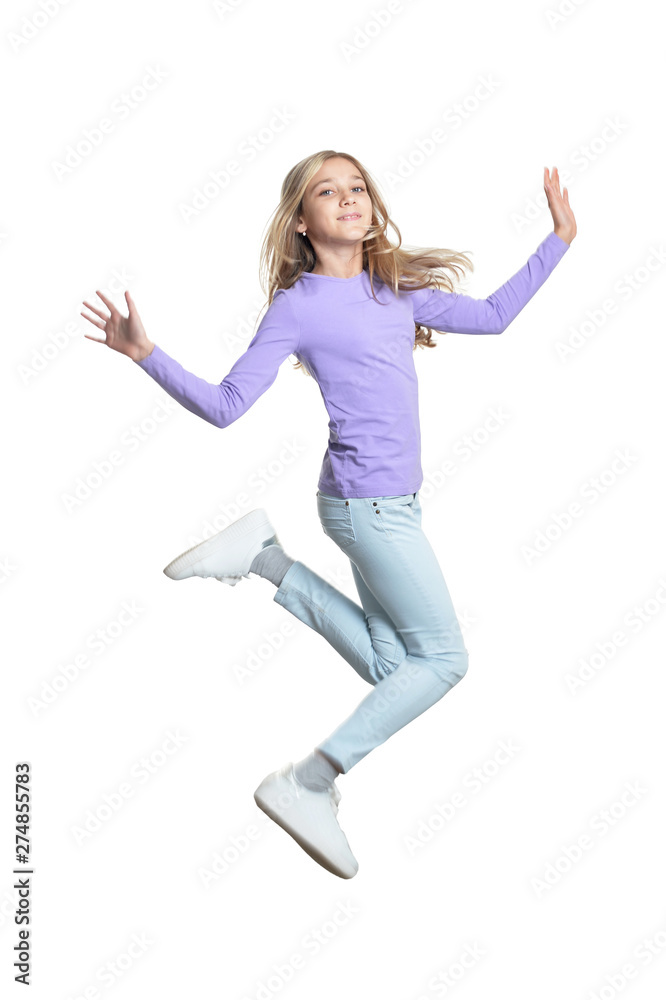 Portrait of cute little girl jumping isolated